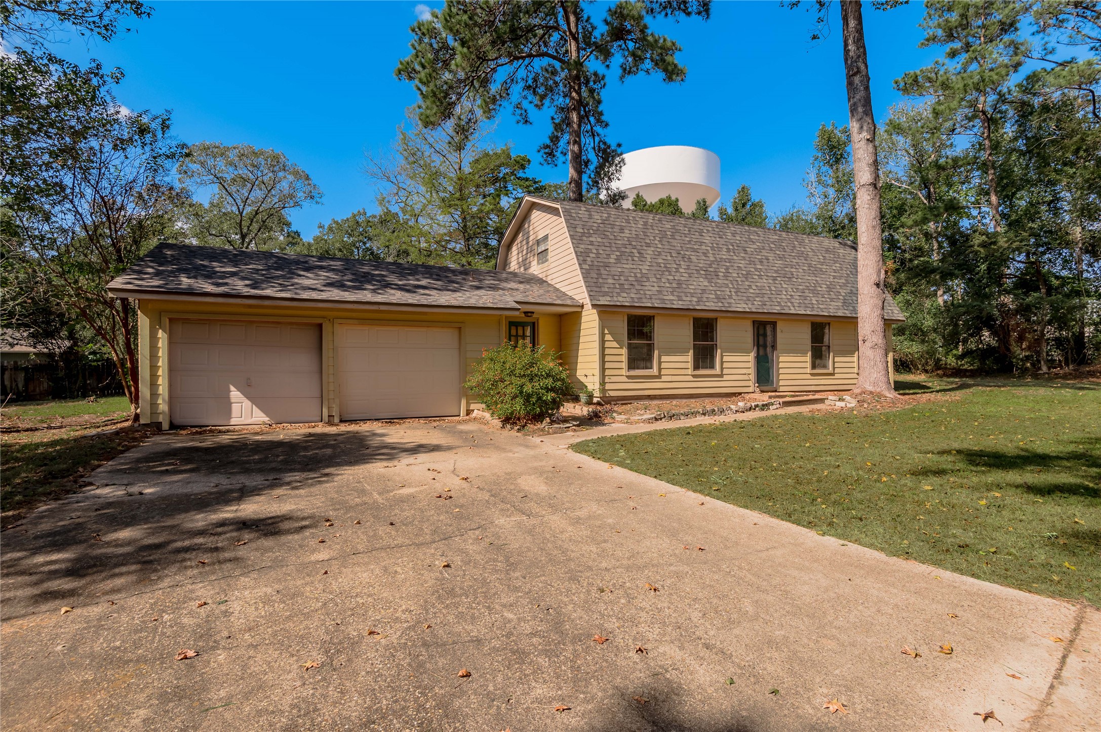 3644 Sage Street Huntsville, TX 77340 - Photo 16 of 20 a front view of a house with a garden
