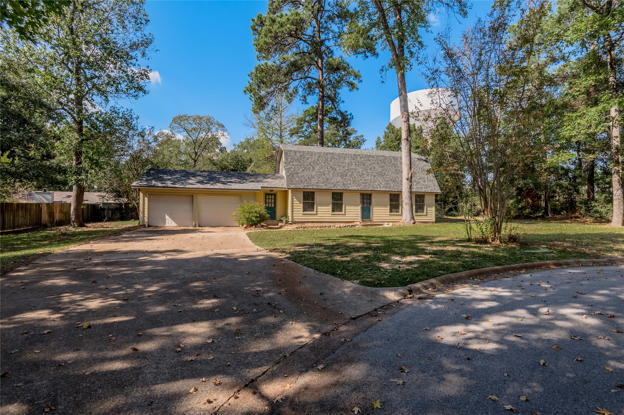 3644 Sage Street Huntsville, TX 77340 - Photo 17 of 20 a front view of a house with a yard and garage