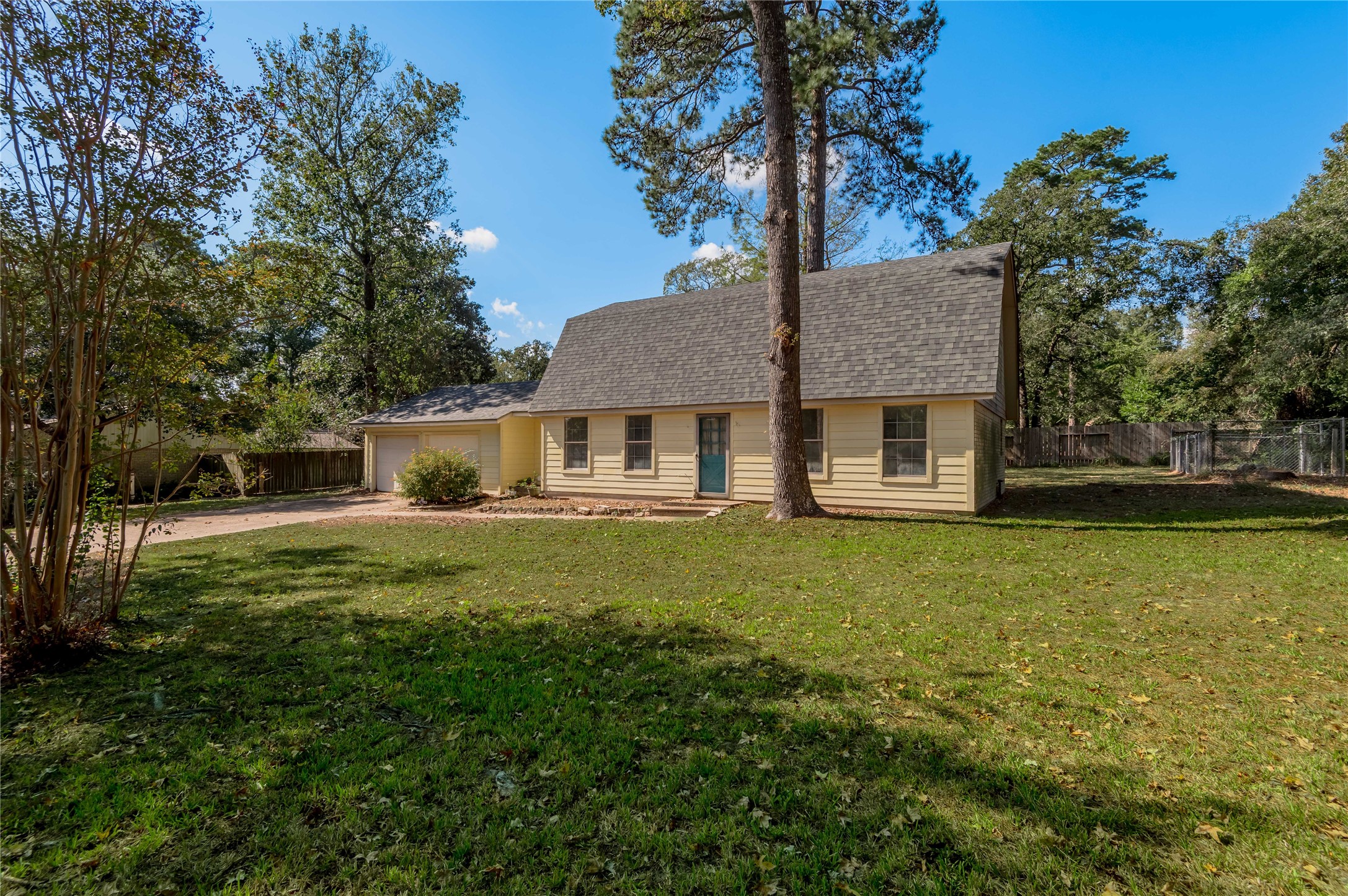 3644 Sage Street Huntsville, TX 77340 - Photo 18 of 20 a front view of a house with a garden
