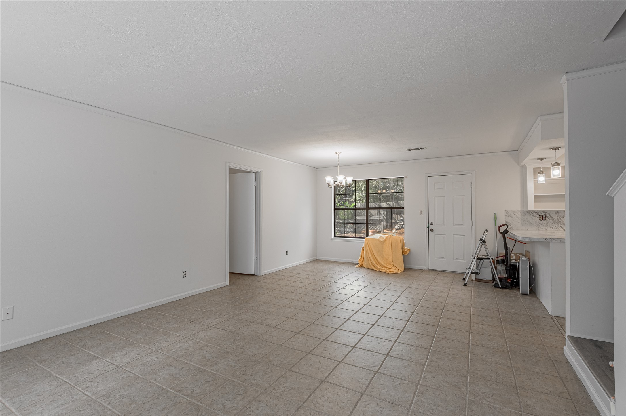 3644 Sage Street Huntsville, TX 77340 - Photo 8 of 20 a view of an empty room with furniture and a window