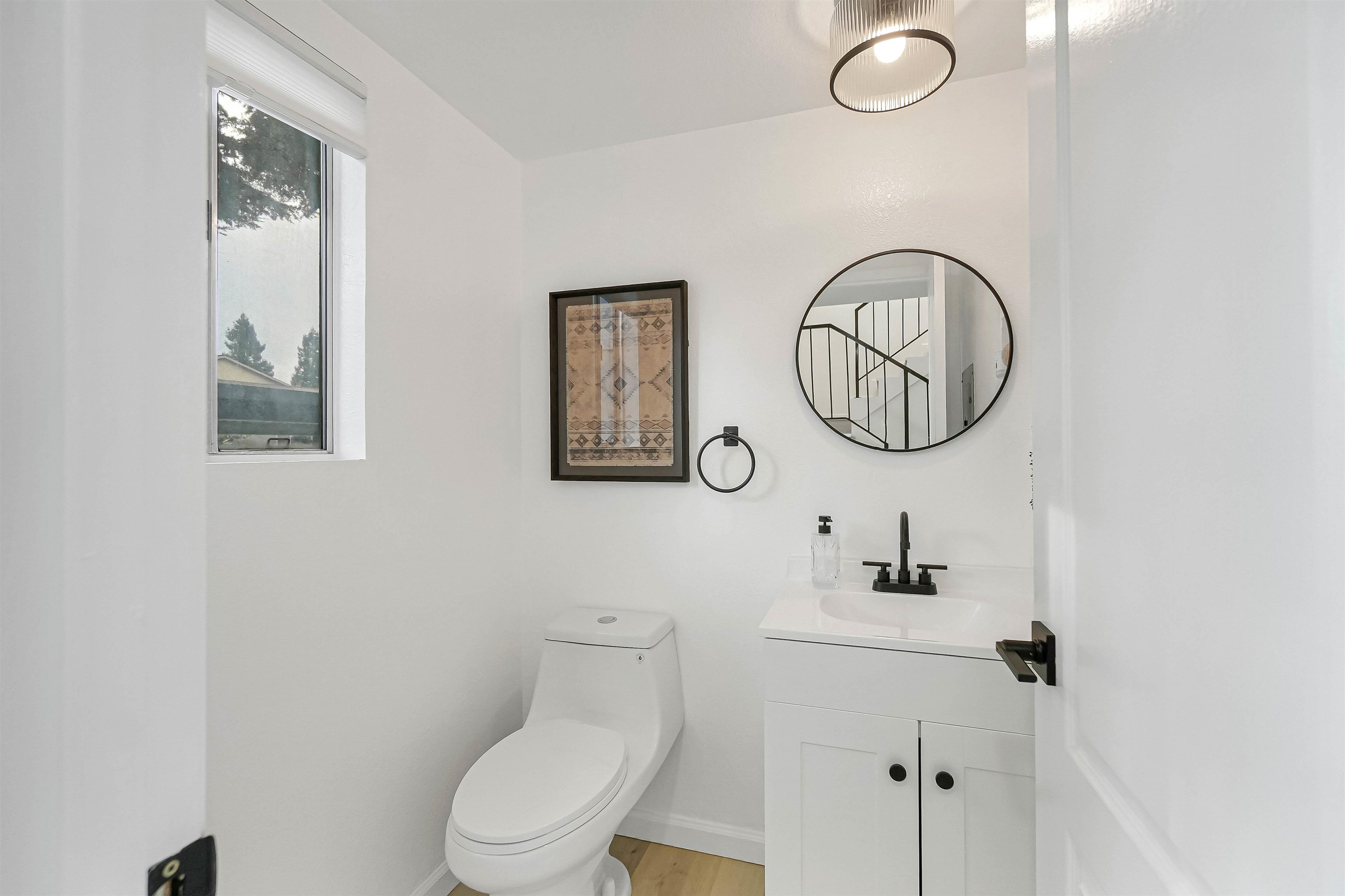 20115 Redwood Road, Unit 9 Castro Valley, CA 94546 - Photo 27 of 47 a bathroom with a toilet a sink and mirror