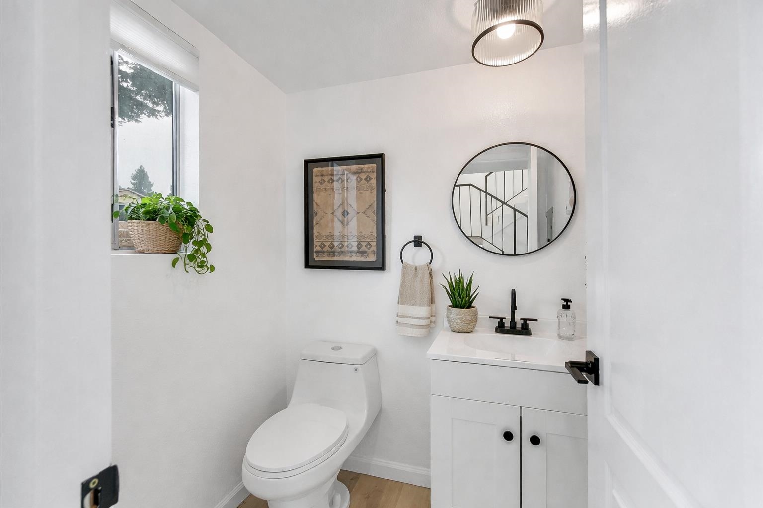 20115 Redwood Road, Unit 9 Castro Valley, CA 94546 - Photo 28 of 47 a bathroom with a toilet a sink and a mirror