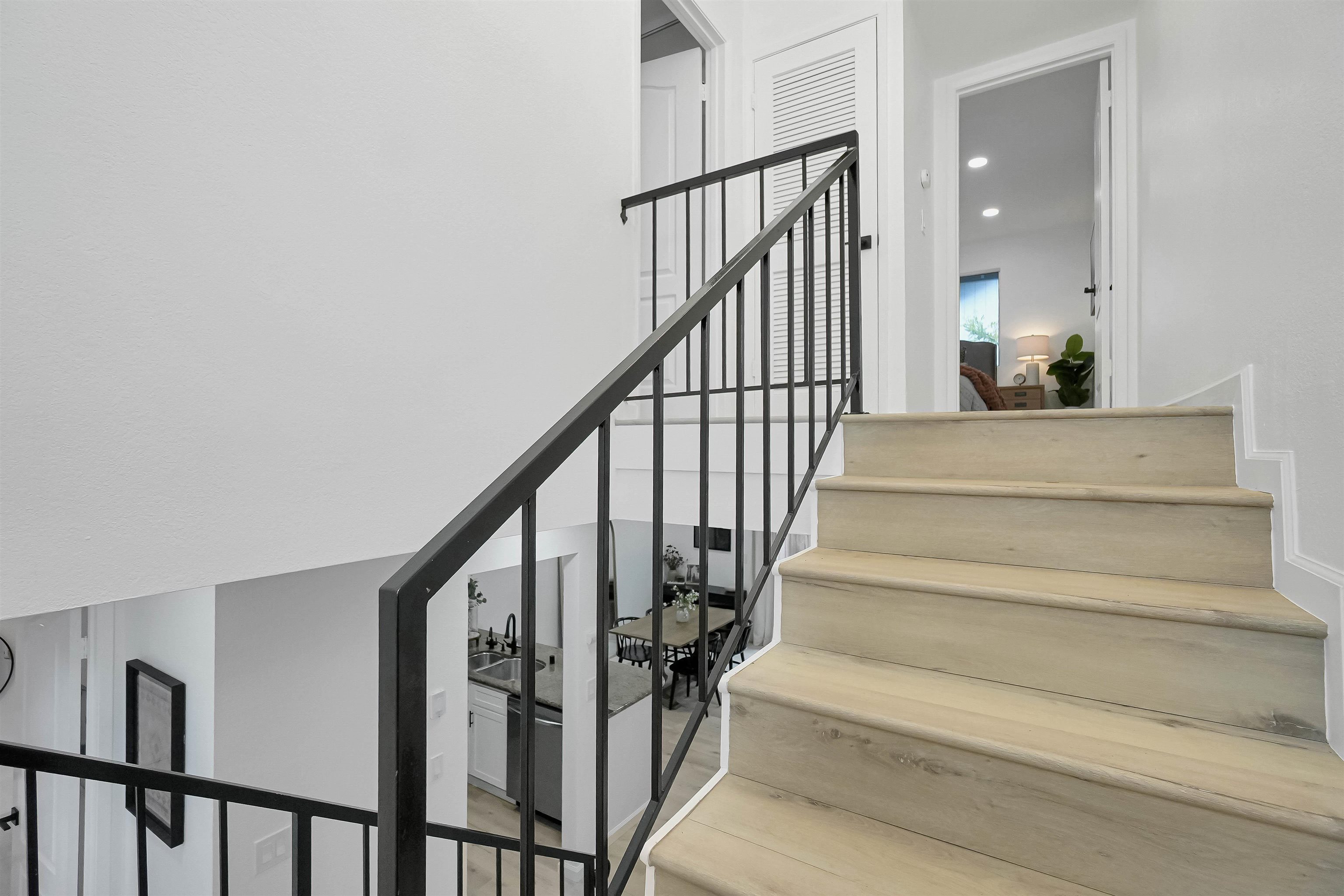 20115 Redwood Road, Unit 9 Castro Valley, CA 94546 - Photo 29 of 47 a view of staircase with wooden floor and a rug