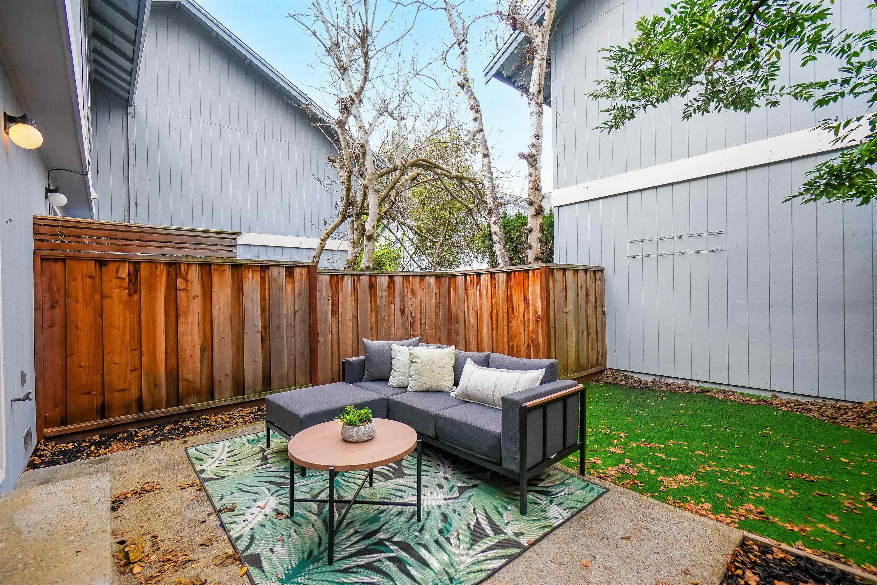 20115 Redwood Road, Unit 9 Castro Valley, CA 94546 - Photo 43 of 47 a backyard of a house with table and chairs