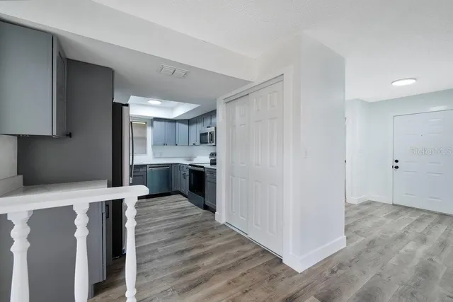 a view of kitchen with wooden floor