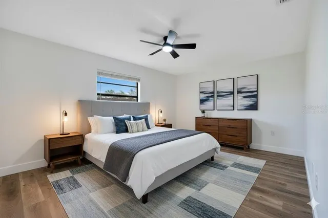 a bedroom with a bed and a view of kitchen