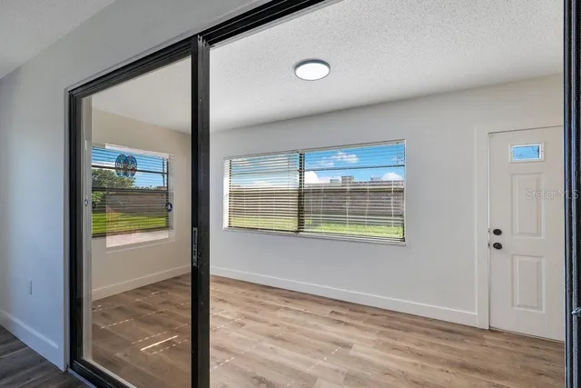 a view of an empty room and window