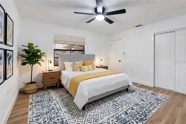 a bedroom with a large bed and a window