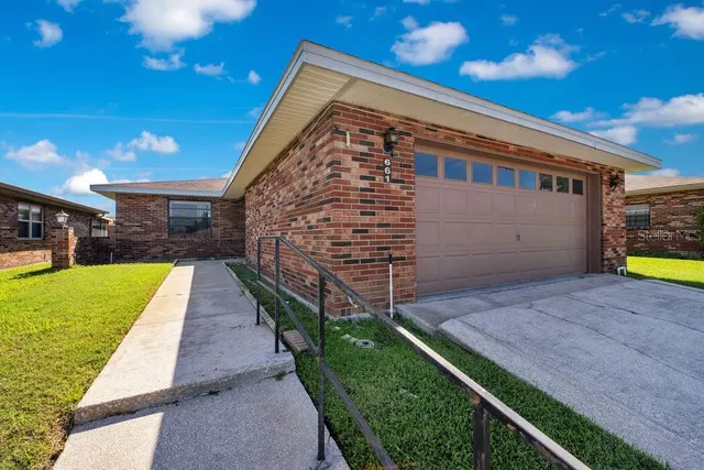 a view of house with backyard