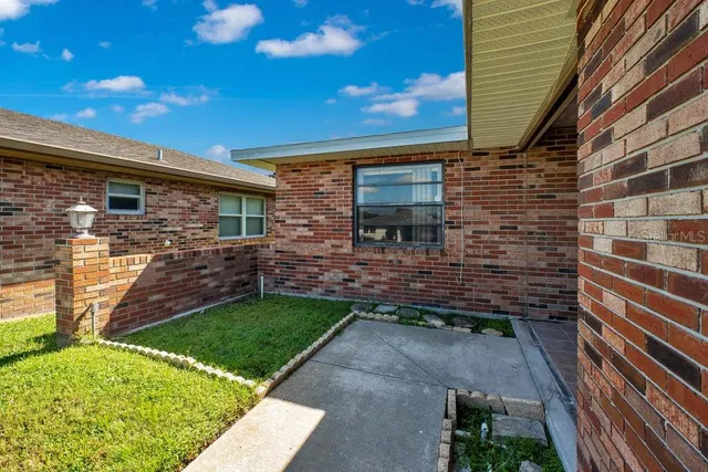 a backyard of a house with lots of green space