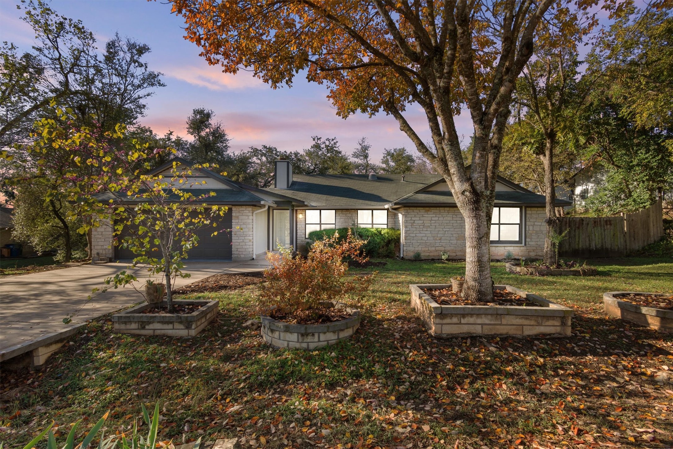 Enjoy the unlikely mix of natural serenity and modern convenience at 8003 Pinto Path in Oak Hill!