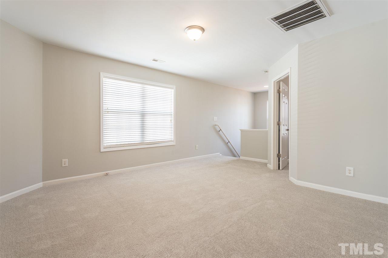 1017 Lombar Street Raleigh, NC 27610 - Photo 14 of 21 a view of an empty room with a window