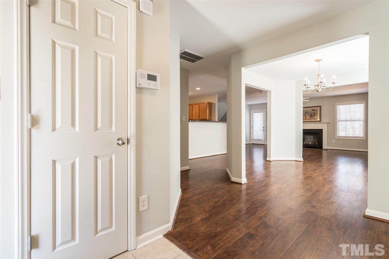 1017 Lombar Street Raleigh, NC 27610 - Photo 3 of 21 a view of a hallway with wooden floor and windows