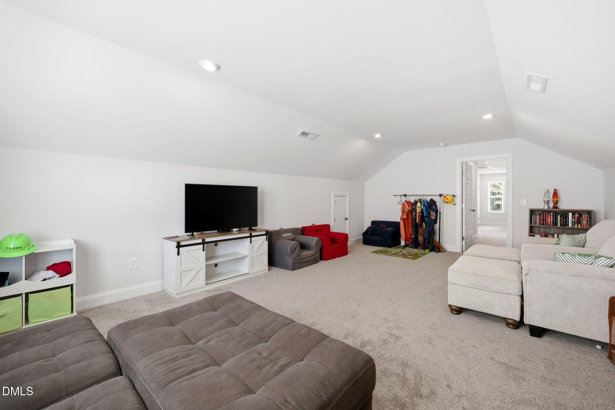 104 Kavanaugh Road Wake Forest, NC 27587 - Photo 25 of 36 a living room with furniture and a flat screen tv