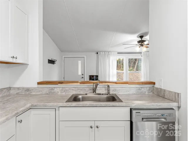 a kitchen with a sink and cabinets