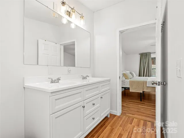 a bathroom with a sink a mirror and a toilet