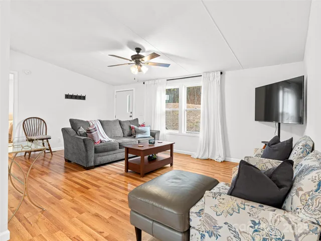 a living room with furniture and a flat screen tv
