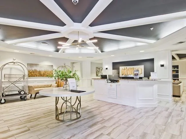 a kitchen with stainless steel appliances granite countertop wooden cabinets and a stove