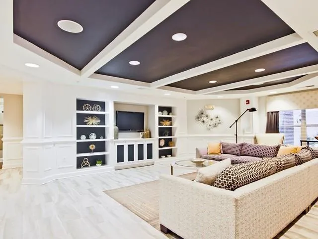 a open kitchen with stainless steel appliances granite countertop a refrigerator and a stove top oven