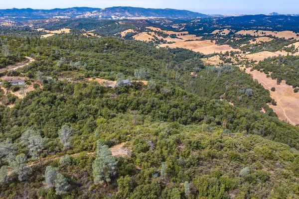 an aerial view of residential house and outdoor space