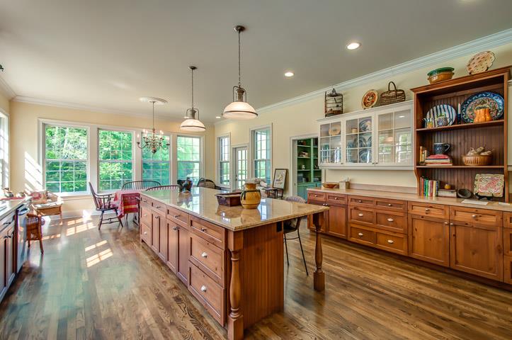 3534 Lizzie Sharp Pall Mall, TN 38577 - Photo 9 of 27 a kitchen with stainless steel appliances granite countertop sink stove and wooden cabinets