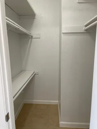 a view of an empty walk in closet