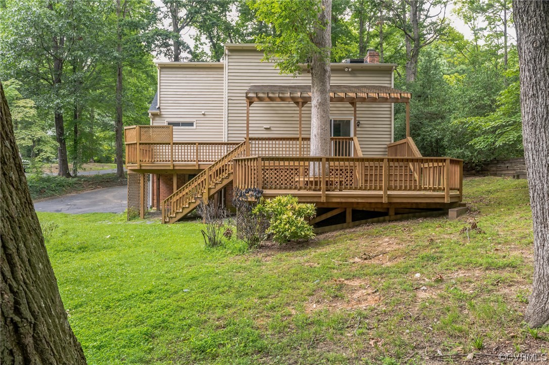 8405 Spring Meadow Road Richmond, VA 23235 - Photo 3 of 33 front view of a house with a yard
