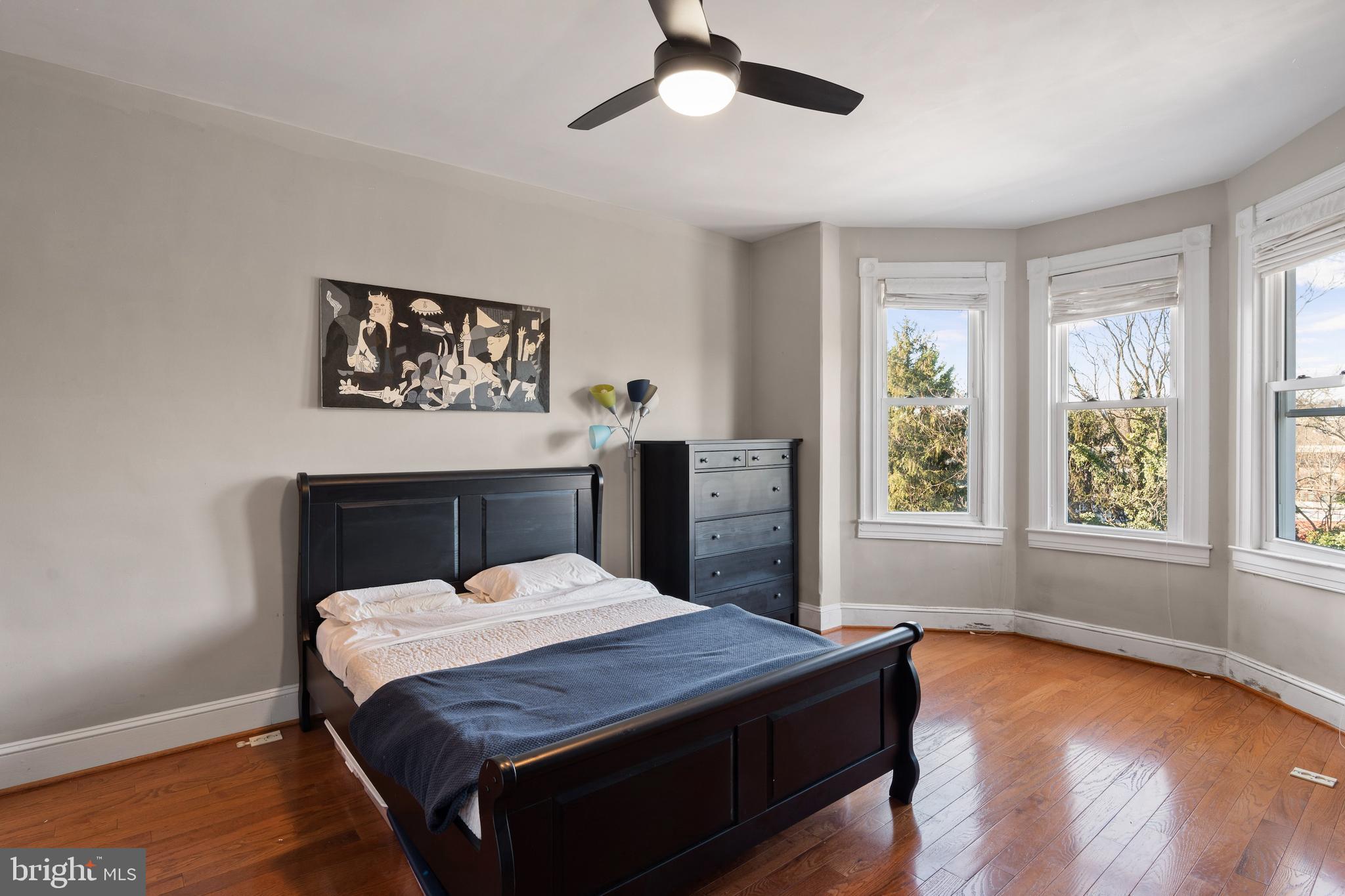 347 Yale Avenue Baltimore, MD 21229 - Photo 19 of 59 a bed sitting in a bedroom next to a window
