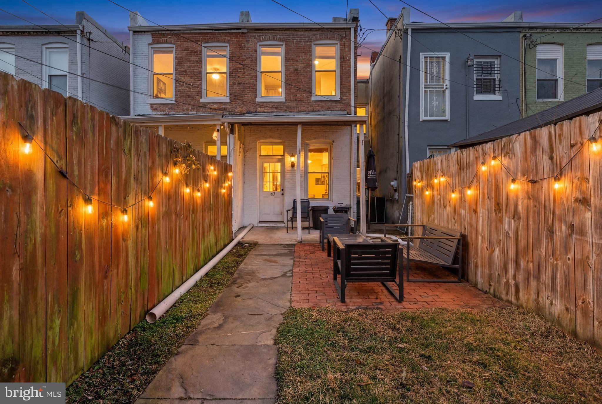 347 Yale Avenue Baltimore, MD 21229 - Photo 2 of 59 a backyard of a house with outdoor seating