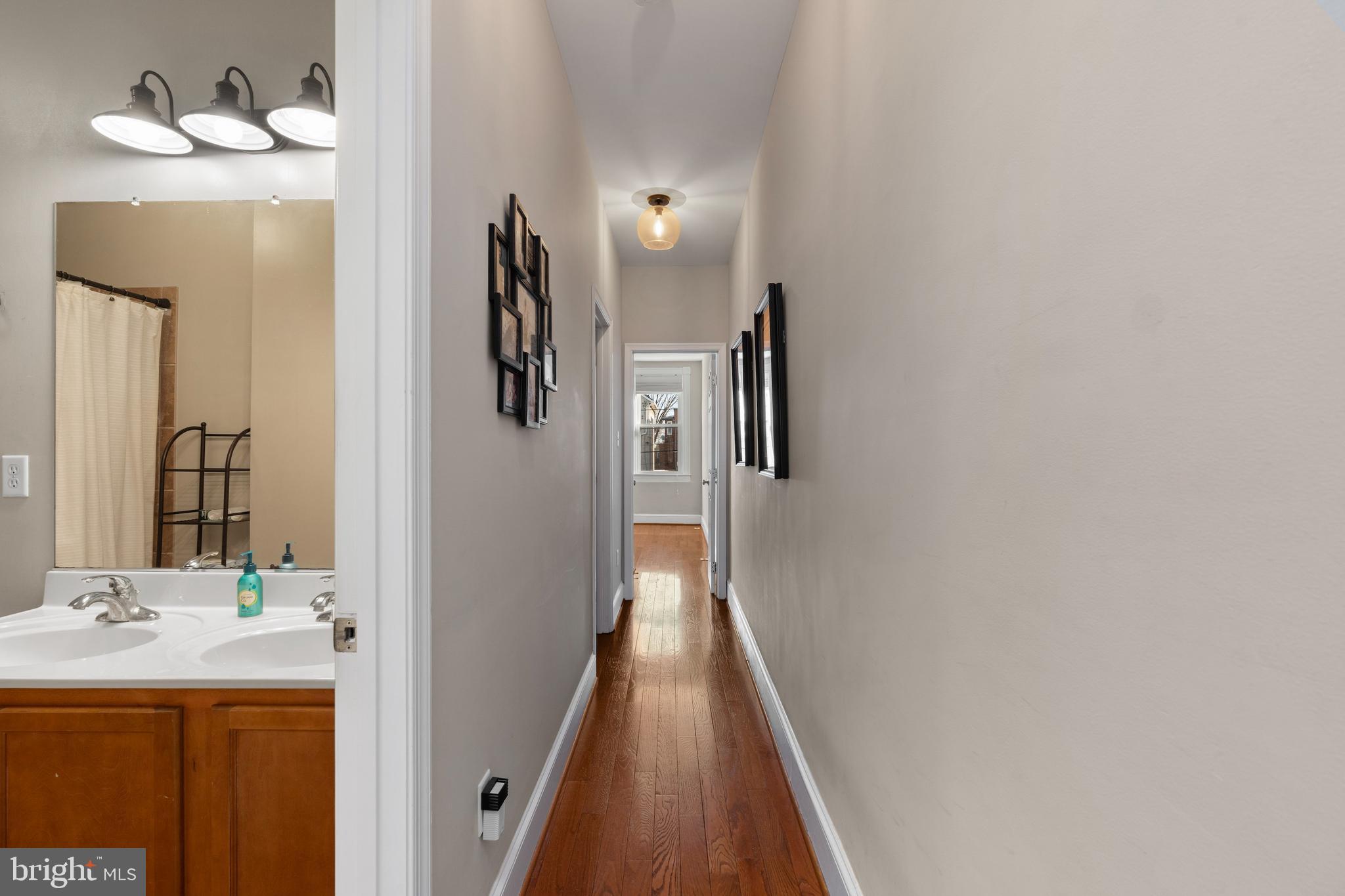 347 Yale Avenue Baltimore, MD 21229 - Photo 22 of 59 a bathroom with a sink and mirror
