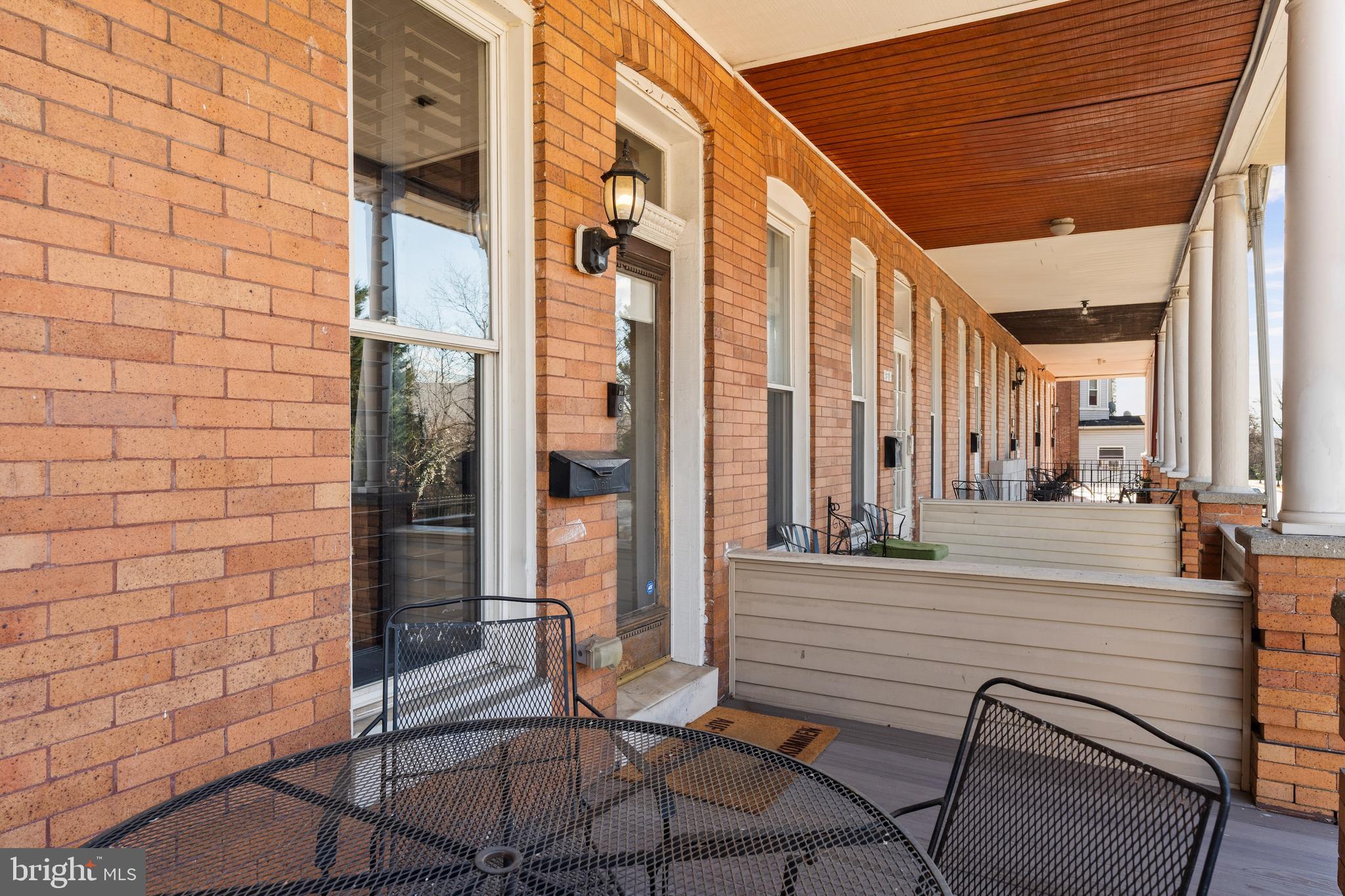 347 Yale Avenue Baltimore, MD 21229 - Photo 3 of 59 a view of a patio with a table and chairs