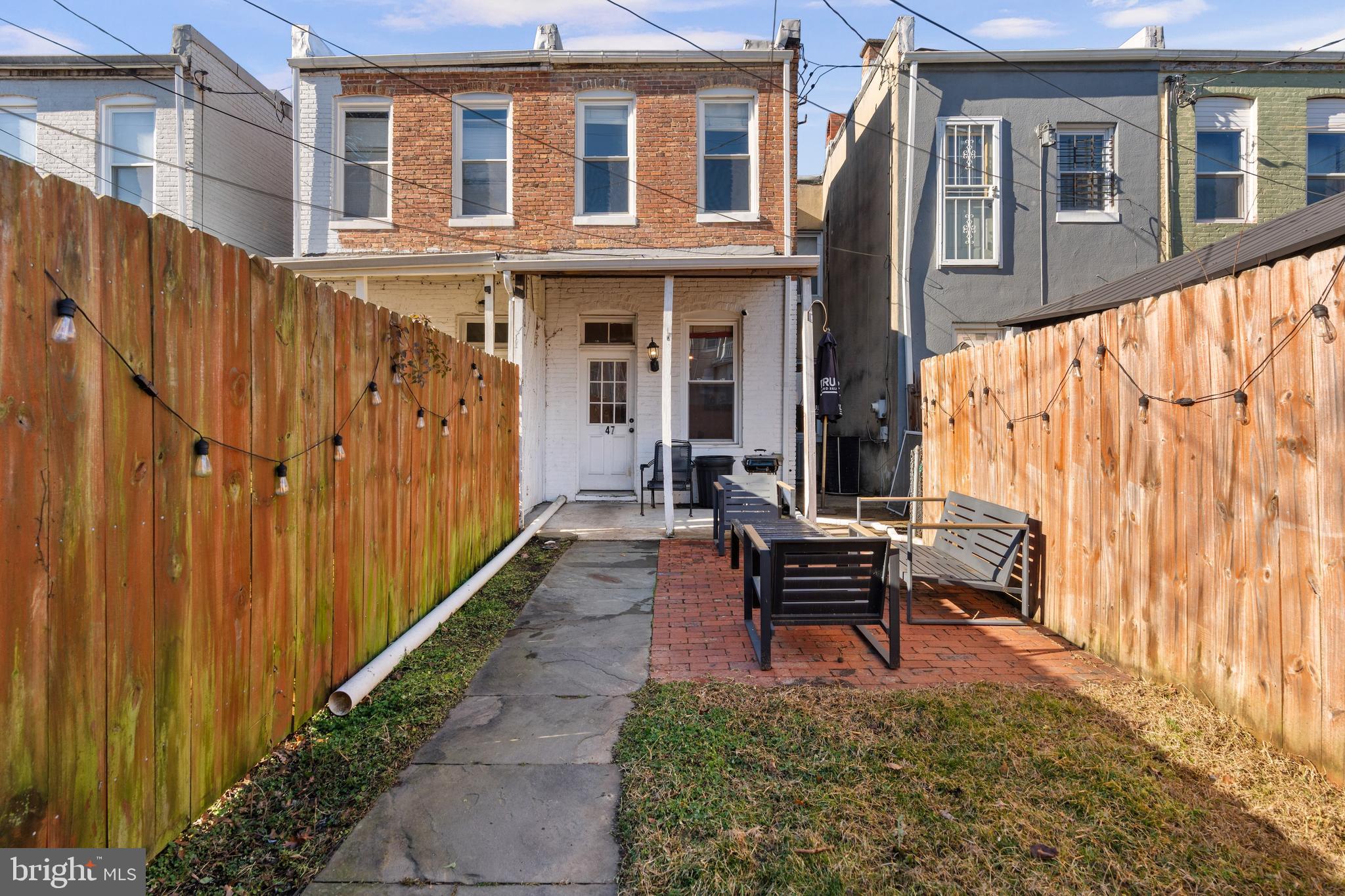 347 Yale Avenue Baltimore, MD 21229 - Photo 42 of 59 a wooden bench sitting in front of a building