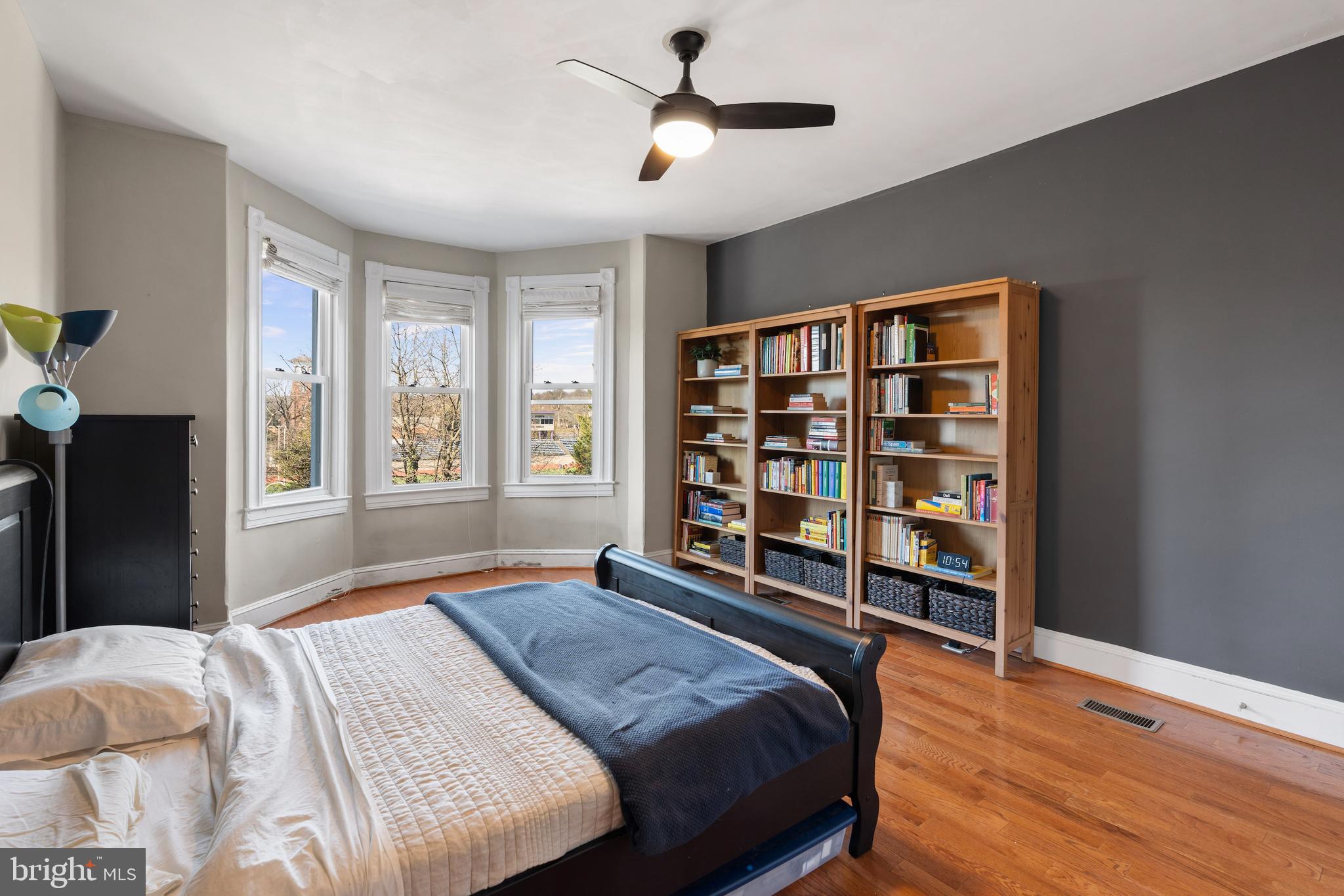 347 Yale Avenue Baltimore, MD 21229 - Photo 7 of 59 a bedroom with a bed and a book shelf