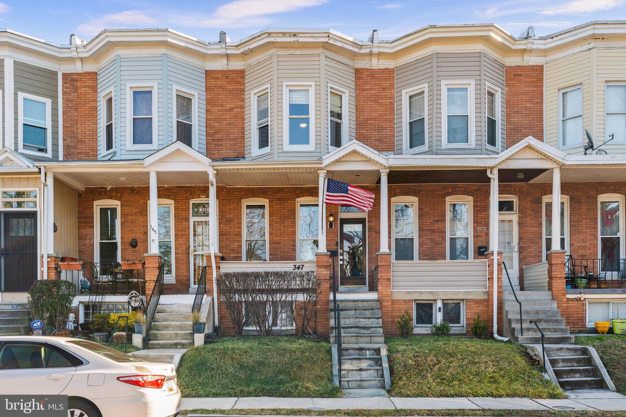 347 Yale Avenue Baltimore, MD 21229 - Photo 9 of 59 a front view of a residential apartment building with a yard