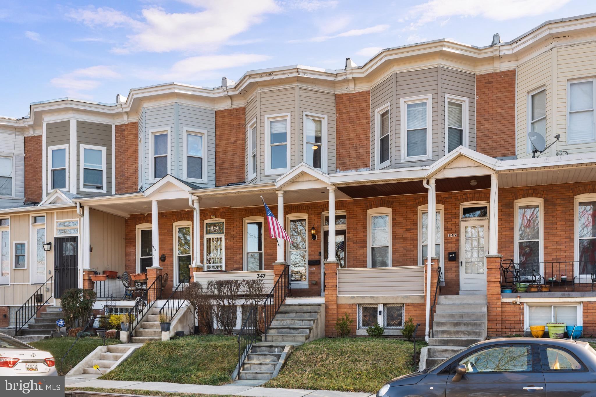 347 Yale Avenue Baltimore, MD 21229 - Photo 10 of 59 a front view of a residential apartment building with a yard