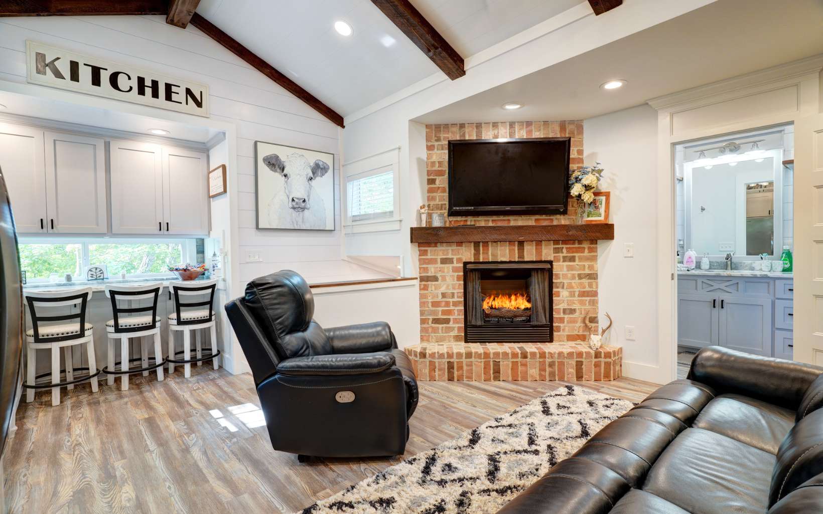 60 Buckeye Branch Road Morganton, GA 30560 - Photo 2 of 21 a living room with furniture flat screen tv and a fireplace