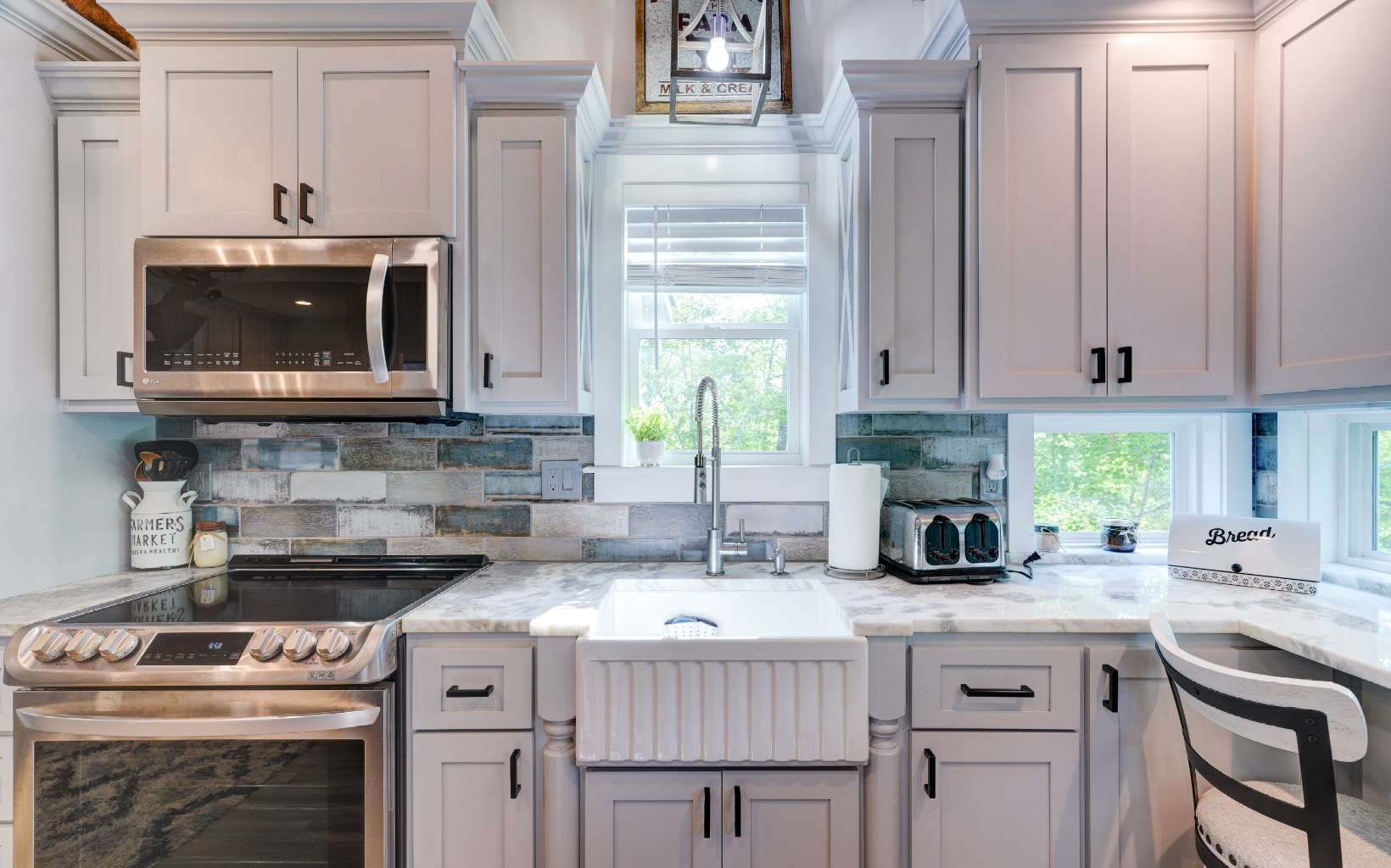 60 Buckeye Branch Road Morganton, GA 30560 - Photo 3 of 21 a kitchen with stainless steel appliances granite countertop a stove a sink and a microwave