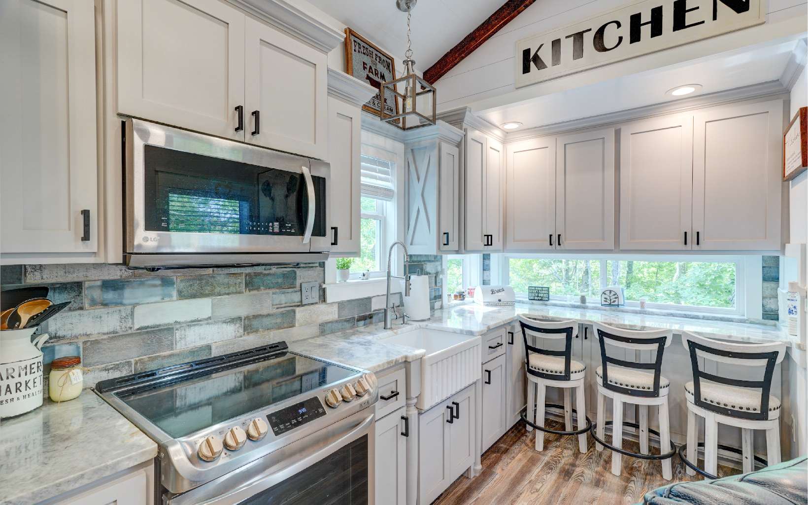 60 Buckeye Branch Road Morganton, GA 30560 - Photo 4 of 21 a kitchen with granite countertop a stove a sink and a refrigerator