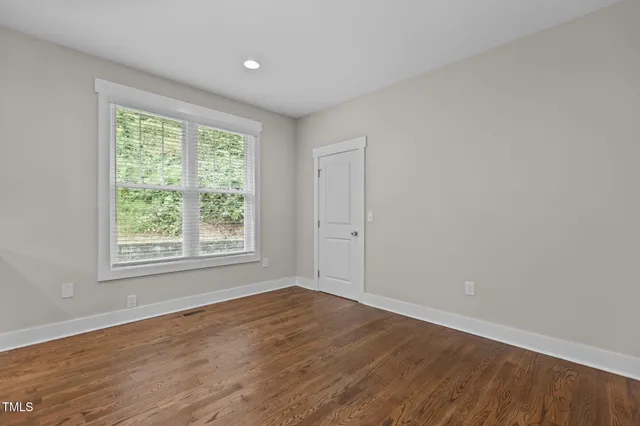 a kitchen with stainless steel appliances granite countertop a refrigerator a stove a sink and a microwave