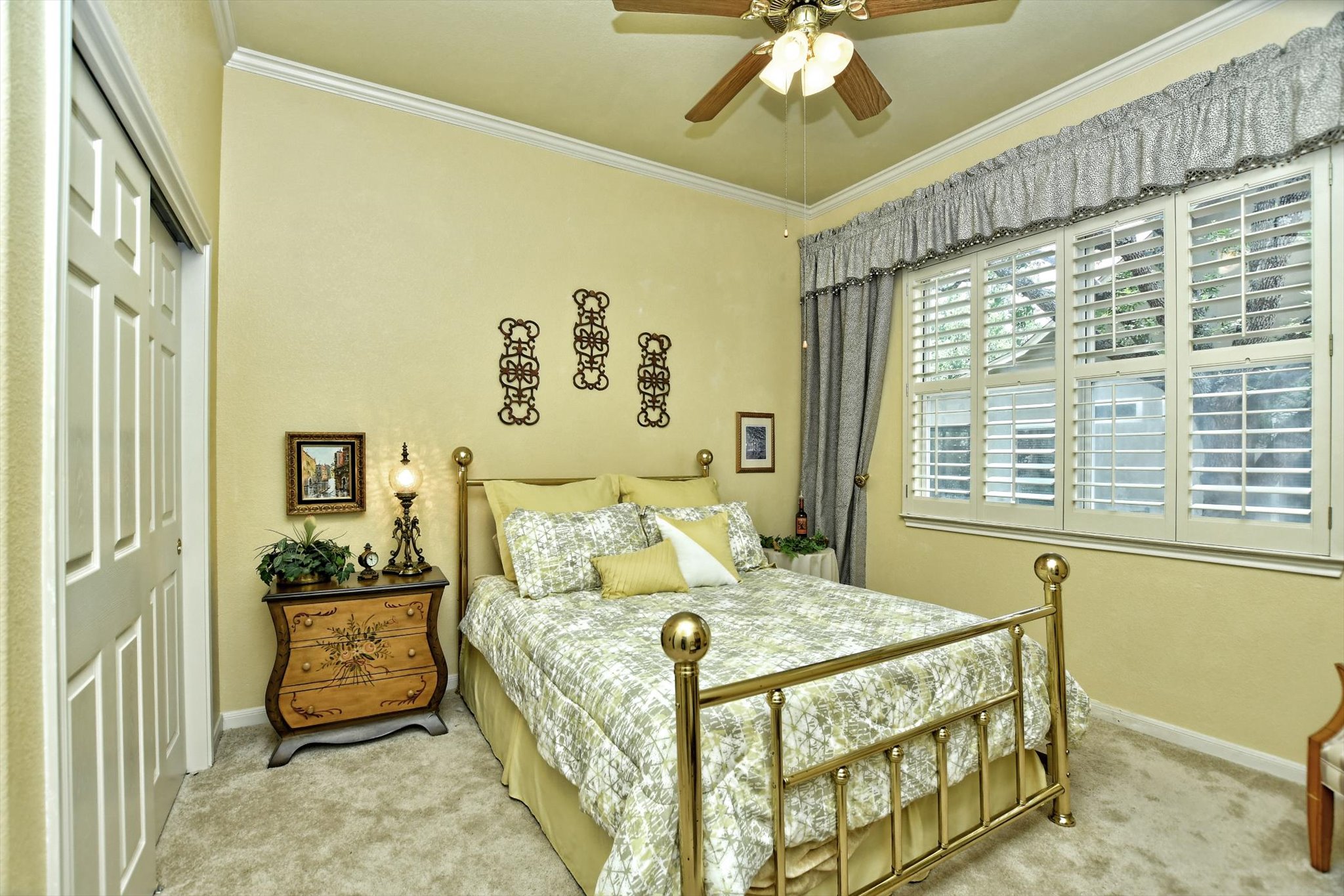 106 Nighthawk Way Georgetown, TX 78633 - Photo 22 of 29 A cheerful bedroom space features a classic brass bed and custom window treatments.