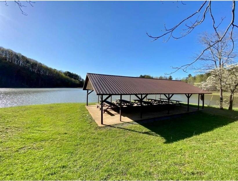 1417 Foxhound Trail Northeast Ranger, GA 30734 - Photo 21 of 21 a view of a swimming pool with a table and chairs