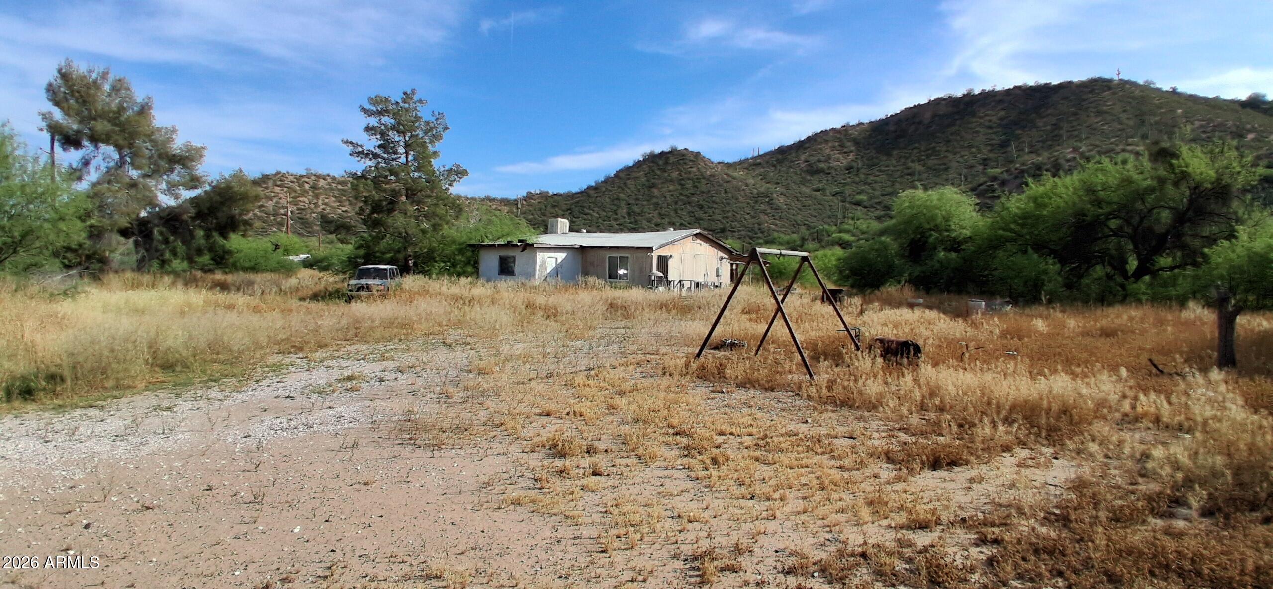 4048 South Cooley Ranch Road Winkelman, AZ 85192 - Photo 1 of 20 a view of a lake with a mountain in the background