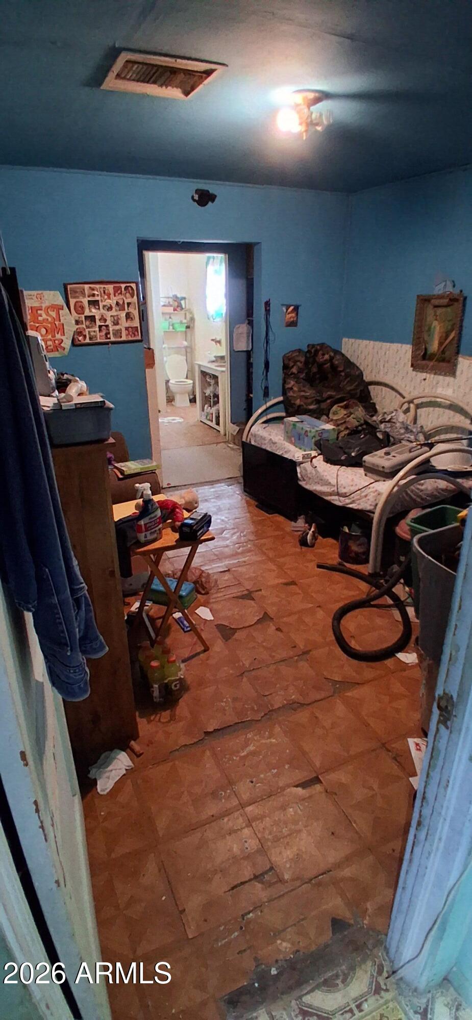 4048 South Cooley Ranch Road Winkelman, AZ 85192 - Photo 12 of 20 a room with gym equipment and a flat screen tv