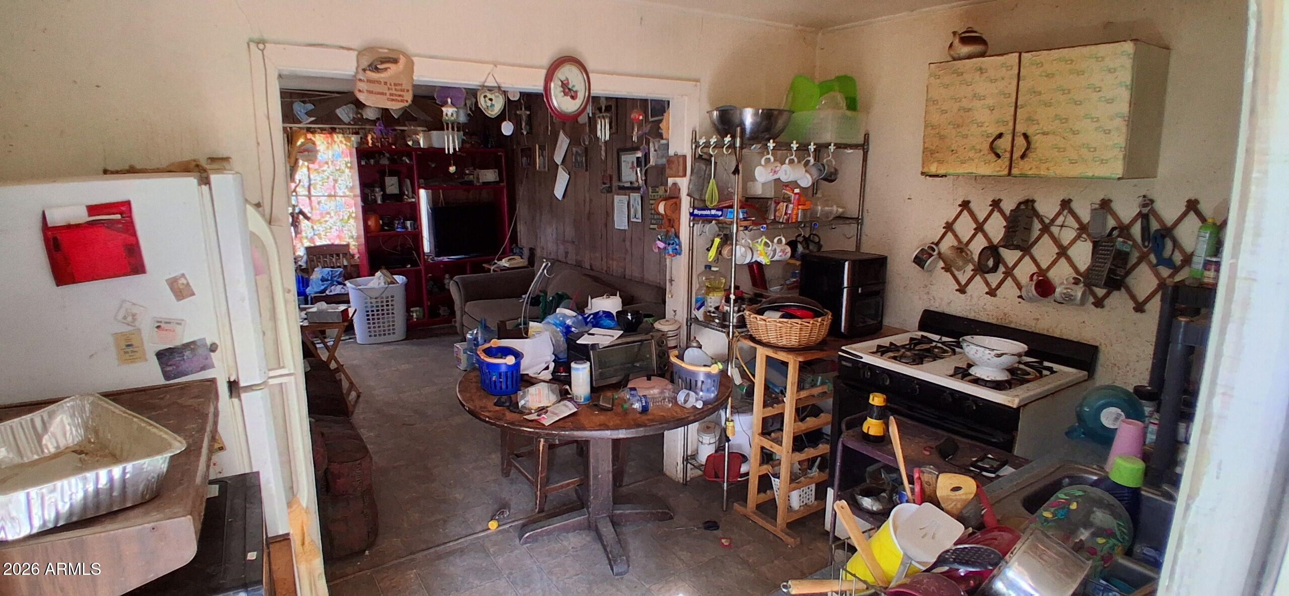 4048 South Cooley Ranch Road Winkelman, AZ 85192 - Photo 5 of 20 a view of a workspace with furniture and toys