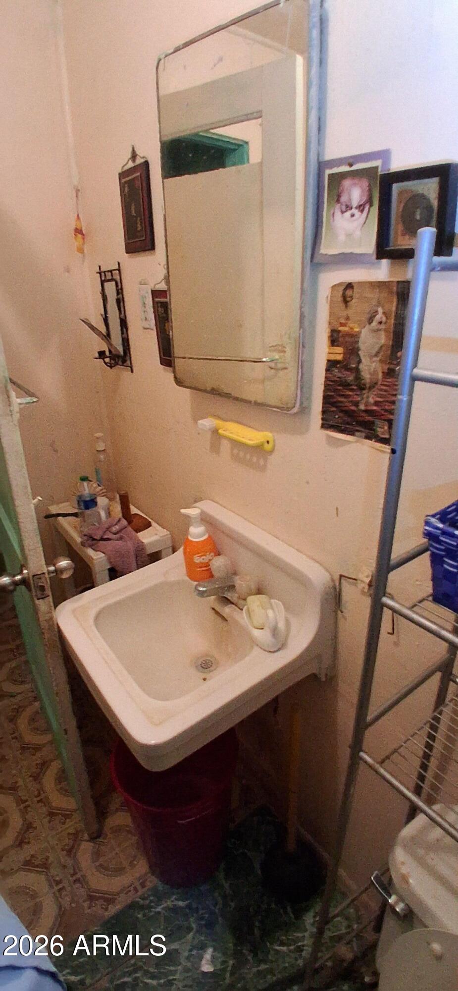 4048 South Cooley Ranch Road Winkelman, AZ 85192 - Photo 10 of 20 a bathroom with a sink a mirror and vanity
