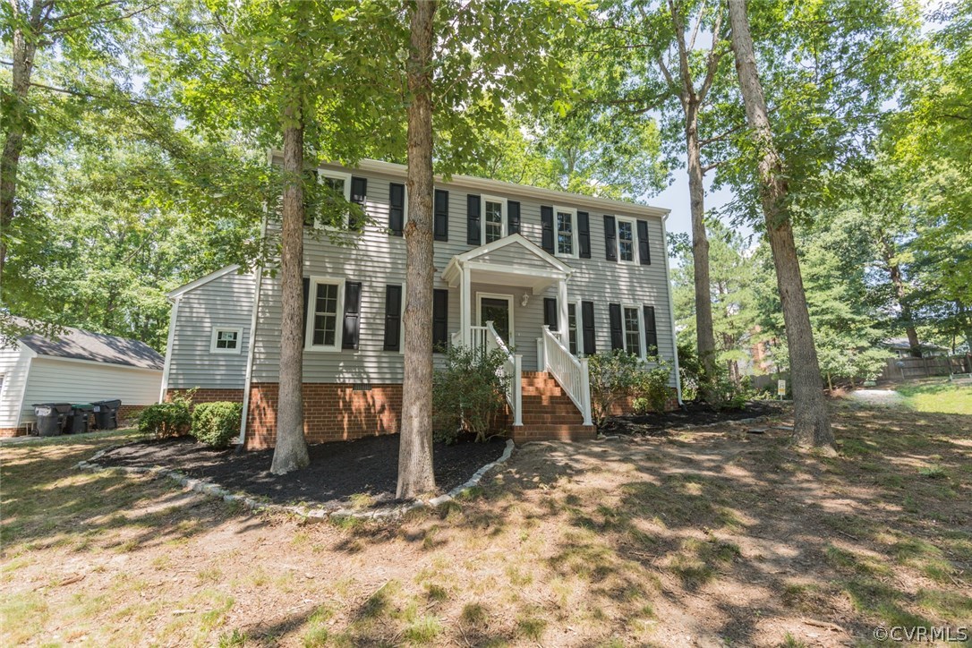 13100 Queensgate Road Midlothian, VA 23114 - Photo 1 of 26 a front view of a house with a yard