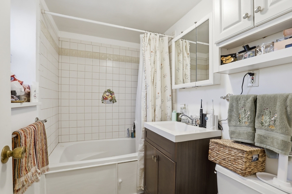 1 Colonial Drive, Unit B1 Andover, MA 01810 - Photo 9 of 14 a bathroom with a sink toilet and shower