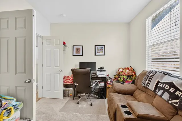 a living room with furniture and a window