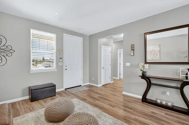 a bedroom with furniture and a window