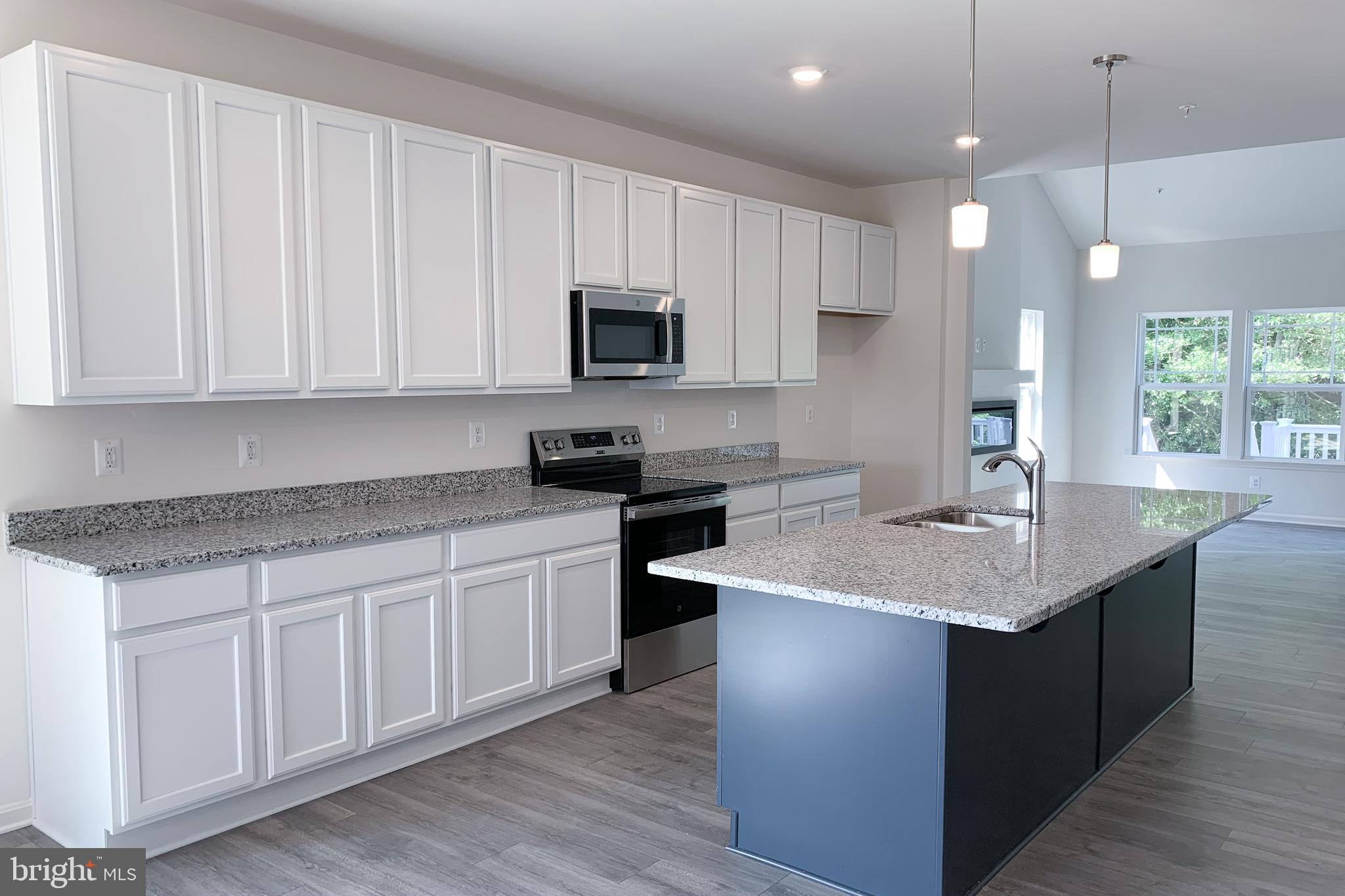 Tbd Tbd Nell Street Perryville, MD 21903 - Photo 12 of 13 a kitchen with a sink dishwasher a stove a microwave oven and a refrigerator with wooden floor